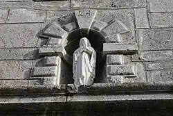 Statue of Mary and key bearing the date 1646.