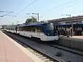 A train arriving at Alsancak railway station on opening day.