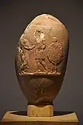 Hoplite greeting an older man with slave carrying the aspis