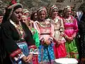 Local women dressed for a festival of Mary, mother of Jesus