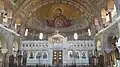 View of the marble Templon and the mural paintings depicting Panagia protecting the city of Patras