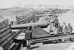 Ft Brady Va-Company C 1st CT heavy Artillery. Gun crew wearing the late-war sack coat. The officer's private purchase blue wool jacket is based on a typical civilian style. The soldier with his back to the camera has a pair of riding boots and several of the men wear civilian hats