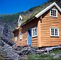 2001. Main building at Sinjarheim has been clad with timber boards and painted by voluntary communal work to preserve historically significant structures.