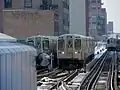An out of service train utilizing the middle pocket track south of the elevated station