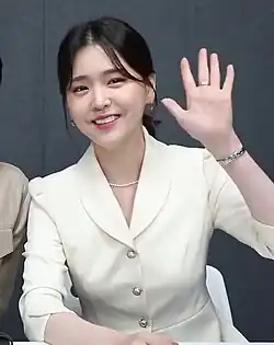 Kim waving for the camera