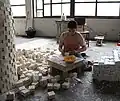 Al Lafeefah or the wrappers are tasked to wrap the soap bars.[17]