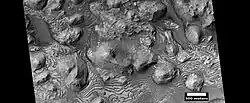 Wide view of layers in Firsoff Crater, as seen by HiRISE under HiWish program.