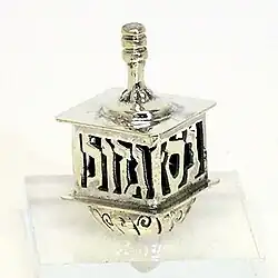 Four-faced dreidel