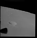 Oblique view of Secchi K satellite crater by Apollo 10. The double ray of Messier A crater is visible in the upper left.