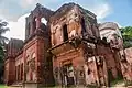 An abandoned building showcasing eclectic architectural influences