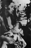 A mother and a child waiting for the turn of treatment in front of Michino'o station, Nagasaki City