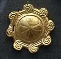 One of 54 identical gold plaques
