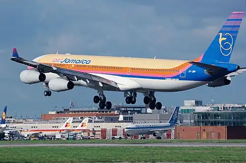 An airliner flaring at London Heathrow Airport (Air Jamaica Airbus A340-300)