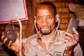 A Yao traditional doctor shows his homemade stethoscope he uses for treatment