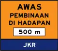 Construction works ahead in 500 m with contractor company name