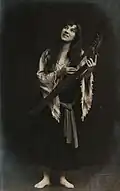 Ludmila Prokopová posing with a musical instrument