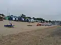 Bathing huts on Porth Fawr beach.[25]