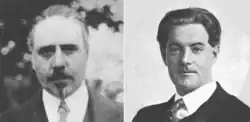 two middle aged white men, one (left) with neat moustache and small imperial beard, balding, the other clean shaven with a full head of dark hair