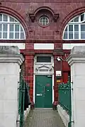 Standard design was also employed when an outside door was part of the build for access to the upper floor(s). A triangular pediment above the doorway and fanlight were the norm.