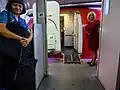 A boarding ramp used to help passengers with mobility issues get onto aircraft, as seen on this Virgin Australia Boeing 737. Flight attendants may assist if required.