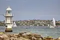 Bradleys Head Light at low-tide, showing the foundation