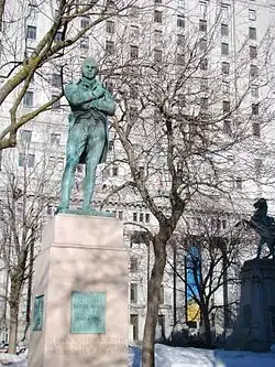 View from western side of the square. Tribute to Robert Burns in the foreground, Boer War Memorial in behind and the Sun Life Building in the background