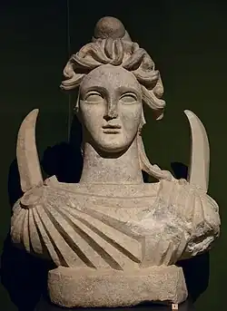 Bust of Men, with crescent moons extending from his shoulders