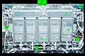 One of the four Controller Panel Assemblies (CPA) bolted to a hatch beam during STS-102 in 2001. Each CPA has one Capture Latch controller (1), four Powered Bolt controllers (2) and circuitry to condition input power (3). A bracket (4) for installation of the M/D "center section" cover is visible on either side of the CPA. The photograph was taken from the PCBM side of the mated vestibule, looking back into the ACBM. The basic individual controller design is also used for the Carbon Dioxide Removal Assembly's Pump Fan Motor Controller, Vent and Relief Valve, and Internal Thermal Control System valves.[6][121]