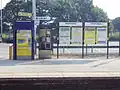 The ticket machine and information boards.