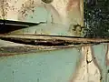 One of the cracked armored plates.