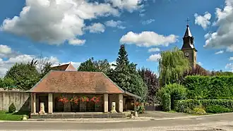 The wash house and church in Chaucenne
