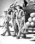 Bombardier cadet with trainer. Note Concrete practice bombs