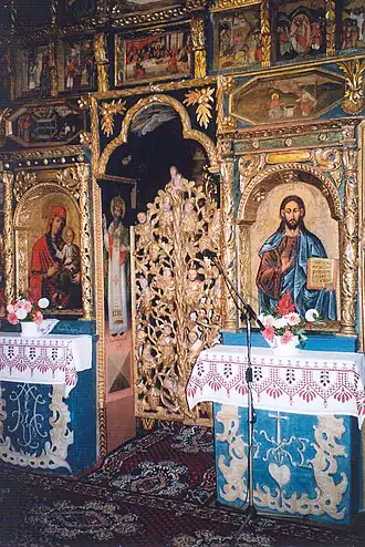 Gilded royal doors carved to represent the tree of life (old wooden church in Chotyniec, Poland)