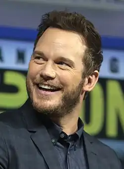 Pratt looking to his right while smiling