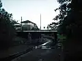 Iron Cove Creek and the Church St bridge looking upstream