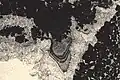 Stalactitic cement in sediment from the supratidal zone, vadose environment, top of "shallowing upward" sequence. Aganane Formation, High Atlas. Thin section. L = 0.3&nbsp;mm.