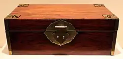 This is a wooden jewel case with metal fittings from Indianapolis Museum of Art.
