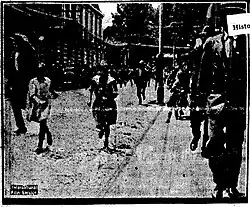 B&W photo of people running on the street