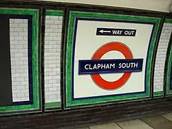 Station roundel with a direction of the way out