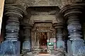 The inside view from Akkana Basadi of Shravanabelagola (1181 A.D.); Pārśvanātha (centre), Dharaṇendra (left) and Padmāvatī (right)