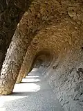 Vaulted retaining wall beneath the road