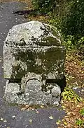 Carved stone in front of a house