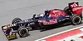 Sponsorship from Falcon Bank brought more gold to the team's livery. This is Daniel Ricciardo driving the STR7 at the 2012 Malaysian Grand Prix.