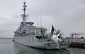 Aft of the frigate De Grasse; the towed sonar is clearly visible