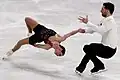 Woman with catch-foot position during backward outside death spiral(Deanna Stellato-Dudek & Maxime Deschamps)
