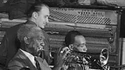 Ewell (top) playing piano in c. June 1946