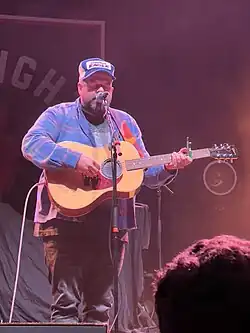 Woods performing in 2023
