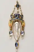 pendant with intertwined dragons, and sapphires