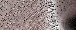 Close, color view of the end of gullies in Russell Crater, as seen by HiRISE