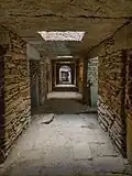 Tombs beneath the stele field.